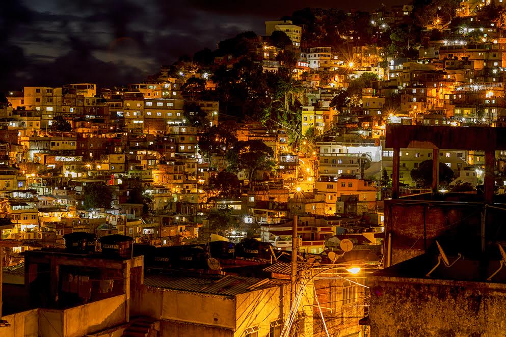 Favela Experience hostel neighborhood lit up at night