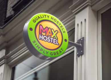 An outdoor sign for a MAX Hostel