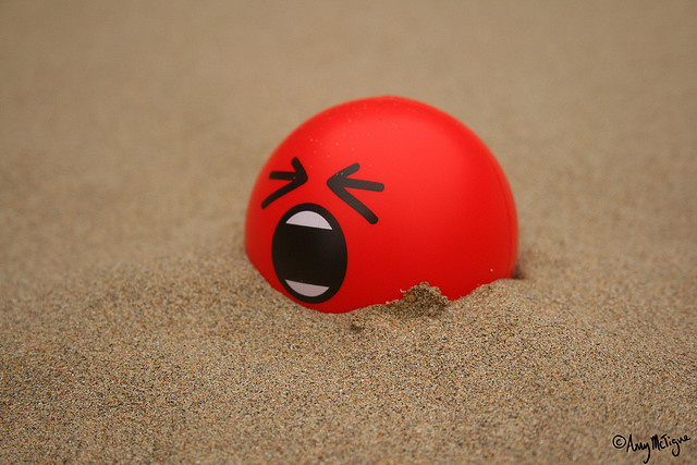 Red squishy stress ball with angry face