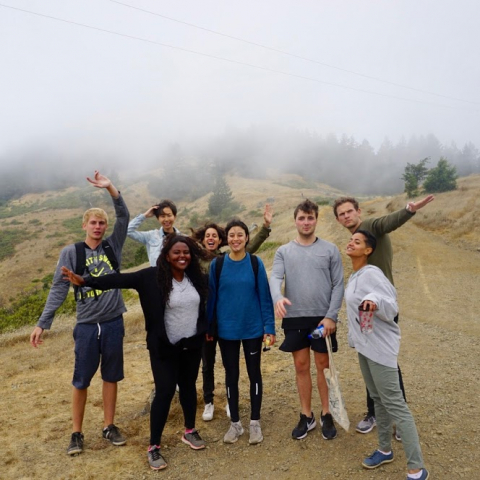 Take your guests on an organized adventure! A group of young people on a hike outside