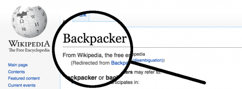 Magnifying Glass on Backpacker Word