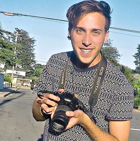 Daniel Lyra holding a camera