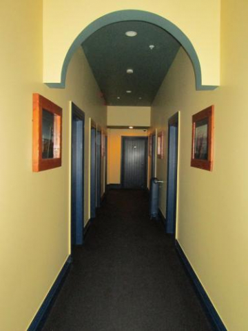 och archhitecture paint colonial interior villa countryhouse backpacker hostel hallway hall doors rooms pictures frame yellow walls