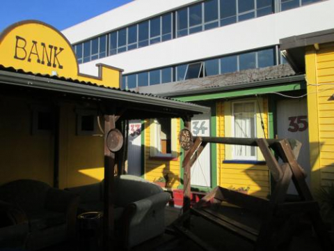the bank at cactus jack building yellow outside couch wooden 34 the bank at cactus jack building yellow outside couch wooden 34